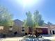 A single-story house exhibits a well-kept front yard, complete with desert landscaping at 16205 W Berkeley Rd, Goodyear, AZ 85395