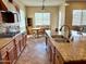 Spacious kitchen featuring granite countertops, a central island, and a dining area at 16205 W Berkeley Rd, Goodyear, AZ 85395