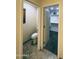 A bathroom featuring a toilet and walk-in closet with shelving and storage for optimal organization at 45737 W Ranch Rd, Maricopa, AZ 85139