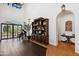 Grand living area featuring a piano, custom cabinetry, and French doors to outdoor area at 21868 E Stacey Rd, Queen Creek, AZ 85142