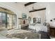 Spacious main bedroom with fireplace, high ceilings, and access to private balcony at 21868 E Stacey Rd, Queen Creek, AZ 85142