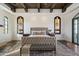Grand main bedroom with stained glass windows and sitting area at 21868 E Stacey Rd, Queen Creek, AZ 85142