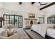Bright and airy main bedroom with beamed ceilings, fireplace, and private patio access at 21868 E Stacey Rd, Queen Creek, AZ 85142