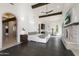 Luxurious main bedroom with fireplace, dark hardwood floors and ensuite bathroom at 21868 E Stacey Rd, Queen Creek, AZ 85142
