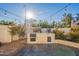 Outdoor kitchen featuring a built-in grill and prep space at 7 W Sarah Ln, Tempe, AZ 85284