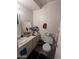 Standard bathroom featuring a sink, toilet, and mirror at 3802 N 79Th Ave, Phoenix, AZ 85033