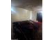 Showing bedroom featuring dark decor, a ceiling fan, and a bed at 3802 N 79Th Ave, Phoenix, AZ 85033