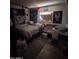 Showing a cluttered bedroom with a bed, crib, and decorations at 3802 N 79Th Ave, Phoenix, AZ 85033