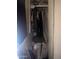 Standard closet full of clothing, storage bin, and personal items at 3802 N 79Th Ave, Phoenix, AZ 85033