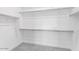 Walk-in closet with carpet and adjustable shelving at 14155 W Alameda Rd, Surprise, AZ 85387