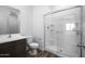 Bathroom featuring a glass-enclosed shower, vanity, and vinyl floors at 24594 W St Catherine Ave, Buckeye, AZ 85326