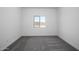 Cozy bedroom with neutral carpet, a window with views, and natural light at 24624 W St Catherine Ave, Buckeye, AZ 85326