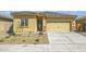 Charming single-story home with a well-manicured gravel front yard and attached two car garage at 24624 W St Catherine Ave, Buckeye, AZ 85326