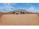 Expansive backyard surrounded by a privacy wall, perfect for creating your dream outdoor oasis at 19539 E Estrella Rd, Queen Creek, AZ 85142
