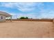 Large, empty backyard, offering limitless possibilities for landscaping, gardening, or outdoor entertaining at 19539 E Estrella Rd, Queen Creek, AZ 85142