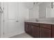 Bathroom featuring a modern vanity with dark wood cabinets, white countertop, and a bright, clean aesthetic at 19539 E Estrella Rd, Queen Creek, AZ 85142