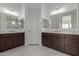 Elegant bathroom featuring dual vanities, marble countertops, and modern fixtures at 19539 E Estrella Rd, Queen Creek, AZ 85142