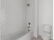 Bright bathroom with a shower and tub combination featuring white subway tile and modern fixtures at 19539 E Estrella Rd, Queen Creek, AZ 85142