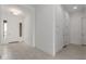 Inviting entryway with white door and tile flooring at 19539 E Estrella Rd, Queen Creek, AZ 85142