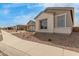 Exterior view of a single-Gathering home featuring stone accents and desert landscaping at 19539 E Estrella Rd, Queen Creek, AZ 85142