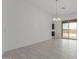 Bright living area with tile flooring and sliding glass doors to the backyard at 19539 E Estrella Rd, Queen Creek, AZ 85142