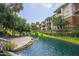 Beautiful water feature winding through the community with lush landscaping and mature trees at 2989 N 44Th St # 3036, Phoenix, AZ 85018