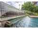 Close up view of a decorative waterfall flowing into a pond in the community water feature at 2989 N 44Th St # 3036, Phoenix, AZ 85018