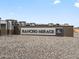 Rancho Mirage community entrance sign with stone and metal accents at 37287 W Patterson St, Maricopa, AZ 85138