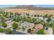 Aerial view of neighborhood with well-maintained homes, desert landscaping, and mountain views creating a picturesque setting at 2920 E Shady Spring Trl, Phoenix, AZ 85024
