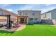 Inviting backyard featuring a covered patio, fire pit, and a well-manicured lawn perfect for entertaining at 2920 E Shady Spring Trl, Phoenix, AZ 85024