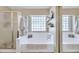 Bright bathroom featuring a large tub with glass block window and a separate shower at 2920 E Shady Spring Trl, Phoenix, AZ 85024
