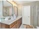 Bathroom featuring a double sink vanity with modern fixtures and a separate shower at 2920 E Shady Spring Trl, Phoenix, AZ 85024