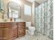 Bathroom featuring stylish vanity and shower with patterned curtain, and hexagon tile floor at 2920 E Shady Spring Trl, Phoenix, AZ 85024