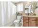Cozy bathroom features a shower, toilet, vanity with cabinets and modern fixtures for convenience at 2920 E Shady Spring Trl, Phoenix, AZ 85024
