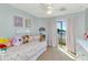 Bright bedroom with a sliding door to a balcony and decorated with soft pastel colors at 2920 E Shady Spring Trl, Phoenix, AZ 85024