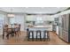 Well-lit kitchen featuring a center island with bar stools, stainless appliances and light wood floors at 2920 E Shady Spring Trl, Phoenix, AZ 85024