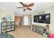 Open loft space featuring a TV, storage, and a view of the staircase at 2920 E Shady Spring Trl, Phoenix, AZ 85024