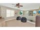 Upstairs loft area with high ceilings, decorative windows and two beanbag chairs at 2920 E Shady Spring Trl, Phoenix, AZ 85024