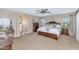 Spacious main bedroom boasts natural light and an arched entryway leading to an en-suite bathroom at 2920 E Shady Spring Trl, Phoenix, AZ 85024