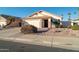 House exterior featuring a two-car garage and desert landscaping at 5730 E Holmes Ave, Mesa, AZ 85206