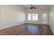 Living room with laminate flooring and sliding glass door at 5730 E Holmes Ave, Mesa, AZ 85206