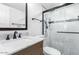 Bright bathroom featuring a marble countertop, dark bronze fixtures and a walk-in shower with glass doors at 4701 N 68Th St # 129, Scottsdale, AZ 85251