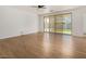 Spacious living area with hardwood floors and sliding glass doors at 19031 W Palo Verde Dr, Litchfield Park, AZ 85340