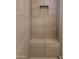 Tiled shower with built-in bench and recessed niche at 19031 W Palo Verde Dr, Litchfield Park, AZ 85340
