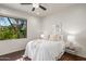 Cozy bedroom featuring wood floors and natural light at 40167 N 110Th Pl, Scottsdale, AZ 85262