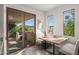 Kitchen nook with wood table and access to outdoor patio at 40167 N 110Th Pl, Scottsdale, AZ 85262