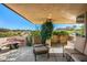 Relaxing patio with fire pit, seating area, and scenic views at 40167 N 110Th Pl, Scottsdale, AZ 85262