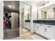 Modern bathroom with walk-in closet and double vanity at 3799 S Skyline Dr, Gilbert, AZ 85297