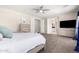 Spacious bedroom with large TV and ensuite bathroom access at 3799 S Skyline Dr, Gilbert, AZ 85297