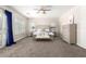 Spacious bedroom with neutral decor, a ceiling fan and plenty of natural light at 3799 S Skyline Dr, Gilbert, AZ 85297